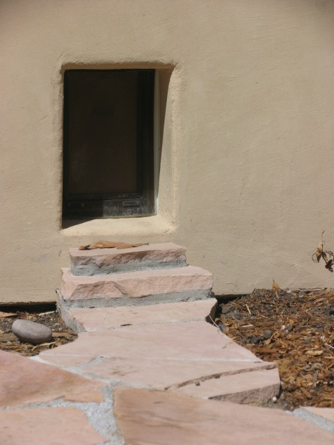 custom doggy door with flagstone path